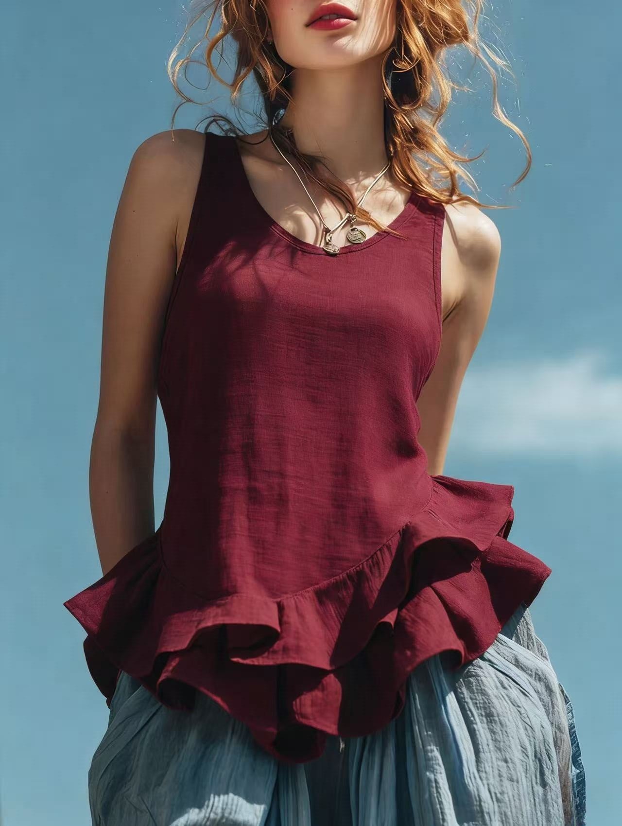Sleeveless women's top with ruffled hem